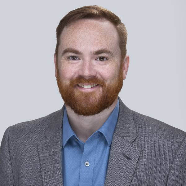 A headshot of Reid Sutton